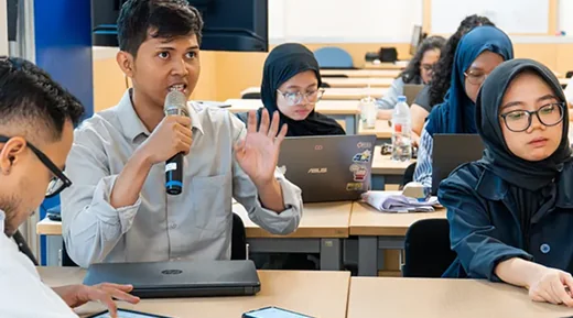 A student presenting ideas during a workshop session