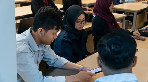 Team members discussing around a table