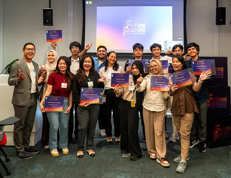 Participants holding their certificates at the ceremony