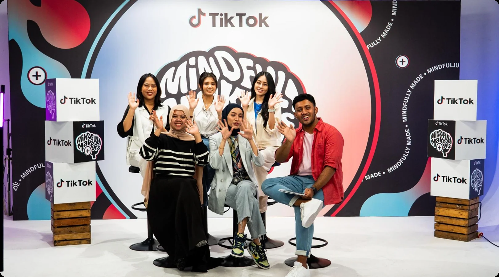 NGO partners and Mindful Makers creators posing together on the TikTok LIVE set