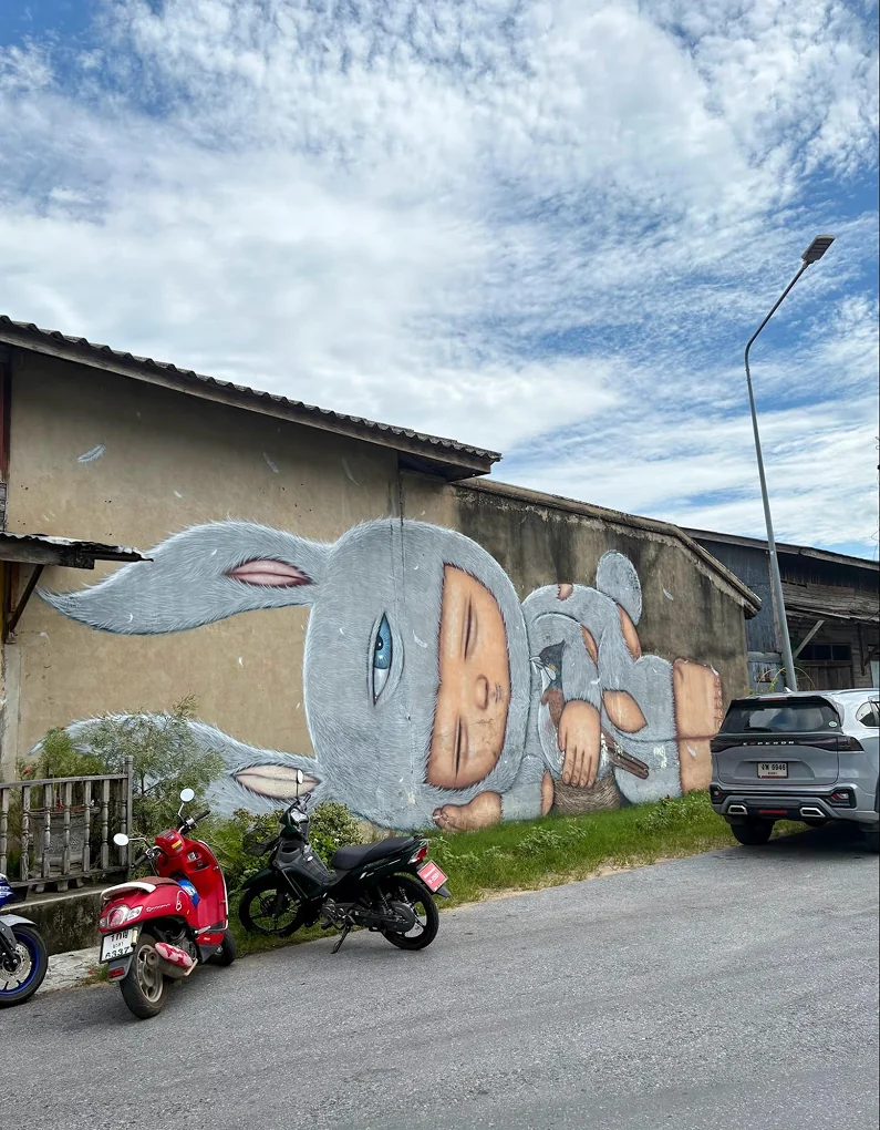A rabbit-themed street mural on a wall in Yala city center