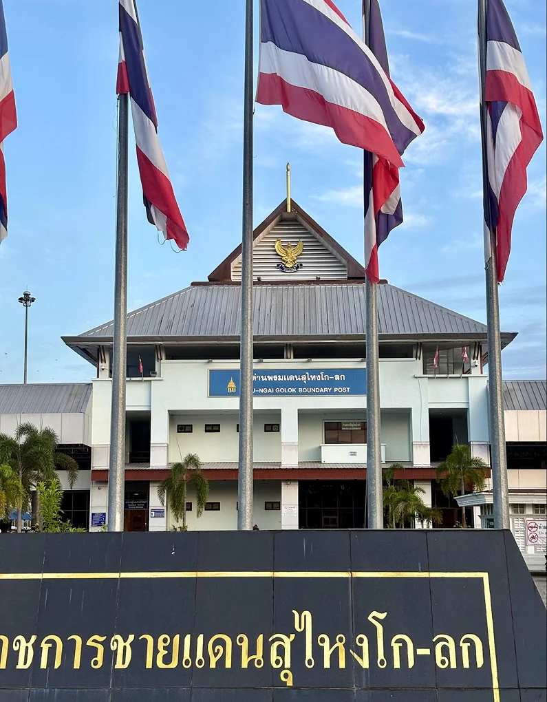 A government building flying Thai flags near the Malaysian border