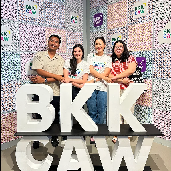 Love Frankie team members standing behind large BKK letters