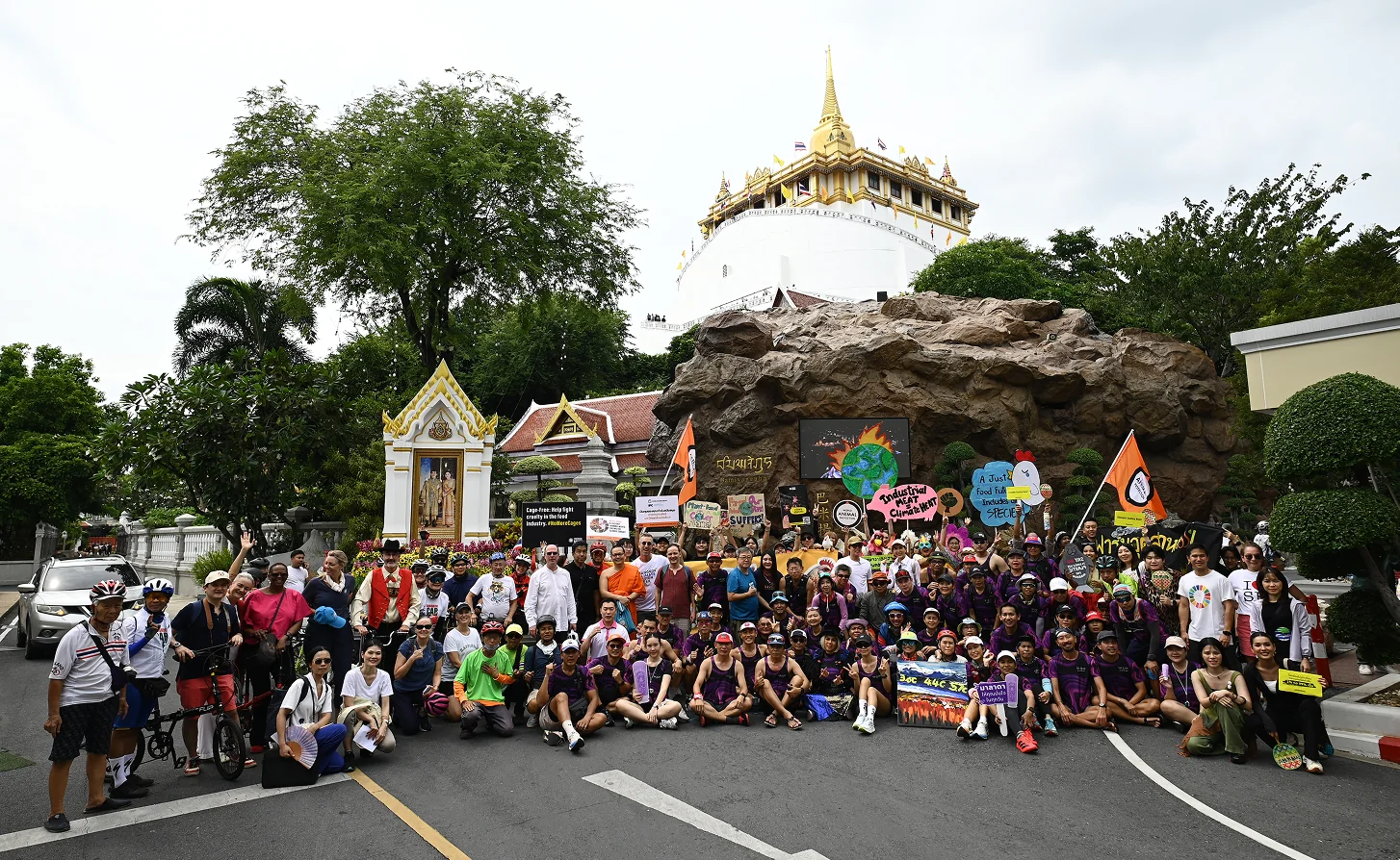 Parade participants gathered in front of a temple